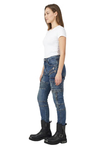 Woman wearing blue jeans and black boots on a white background
