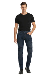 Man wearing a black t-shirt and dark jeans on a white background