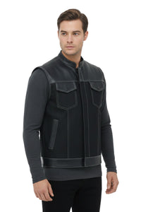 Man wearing a black leather vest on a white background