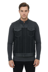 Man wearing a black leather vest on a white background