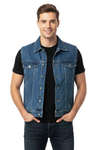 Man wearing a denim vest over a black shirt on a white background