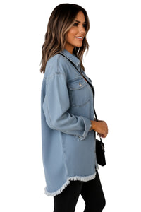 Woman wearing a light blue denim jacket on a white background
