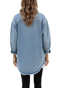 Light blue denim shirt worn by a person on a white background