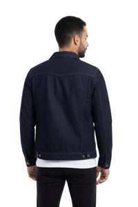 Man wearing a dark denim jacket on a white background