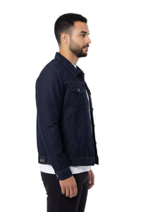 Man wearing a navy denim jacket on a white background