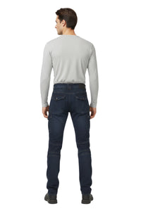 Man wearing a light gray long-sleeve shirt and dark blue jeans on a white background