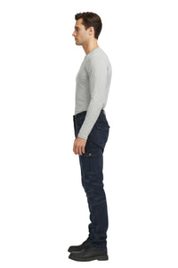 Man wearing dark pants and a light gray shirt on a white background