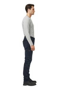 Man wearing dark blue jeans and a light gray sweater on a white background