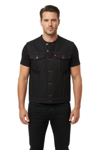 Man wearing a black denim vest with red stitching on a white background