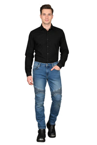 Man wearing a black shirt and blue jeans on a white background