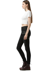 Woman wearing black pants and a white crop top on a white background