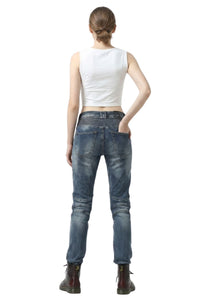 Person wearing blue jeans and a white top on a white background