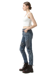 Woman wearing blue jeans and a white top on a white background