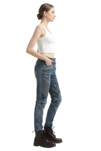Woman wearing blue jeans and a white top on a white background