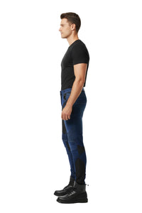 Man wearing blue jeans and black shoes on a white background