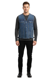 Man wearing a denim vest over a black long-sleeve shirt on a white background