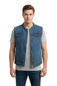 Man wearing a blue denim vest over a gray shirt on a white background