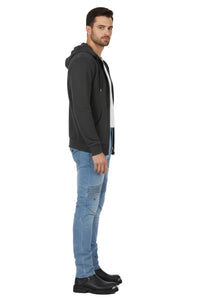Man wearing a black hoodie and blue jeans on a white background