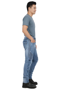 Man wearing light blue jeans with a white background