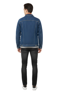 Man wearing a blue denim jacket and black jeans on a white background