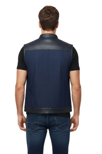 Man wearing a black and navy blue vest on a white background