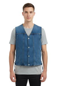 Man wearing a blue denim vest over a gray shirt on a white background