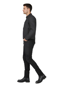 Man wearing a black shirt and black jeans on a white background