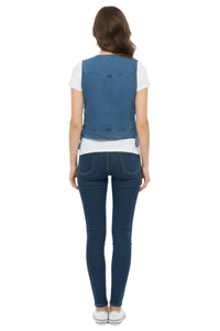 Woman wearing a blue denim vest and jeans on a white background