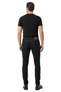 Man wearing black jeans and a black t-shirt on a white background