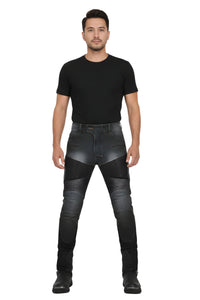 Man wearing black leather pants and a black t-shirt on a white background