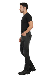 Man wearing black jeans and black shoes on a white background