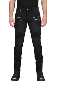 Person wearing black biker jeans with zippers on a white background