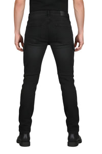 Person wearing black jeans on a white background