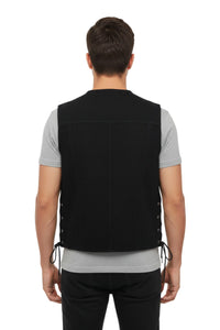 Person wearing a black vest on a white background