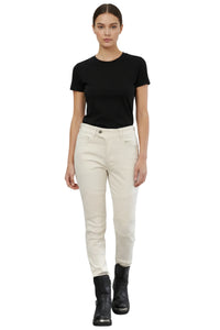 Person wearing a black t-shirt and white pants on a white background