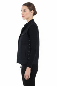 Woman wearing a black jacket on a white background