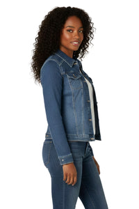 Woman wearing a blue denim jacket and jeans on a white background