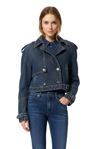 Woman wearing a blue denim jacket and jeans on a white background