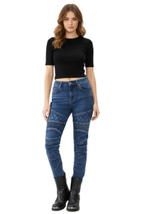 Woman wearing blue jeans and black boots on a white background